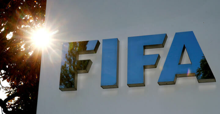 FILE PHOTO: The logo of FIFA is seen in front of its headquarters in Zurich, Switzerland September 26, 2017. REUTERS/Arnd Wiegmann/File Photo